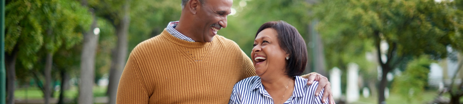 mature couple walking in a park